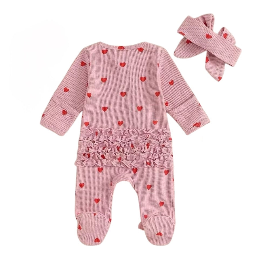 Baby girl long sleeve ruffle onesie with matching headband in pink red hearts – adorable baby outfit available at 1Love 2Hugs 3Kisses Ibiza.
