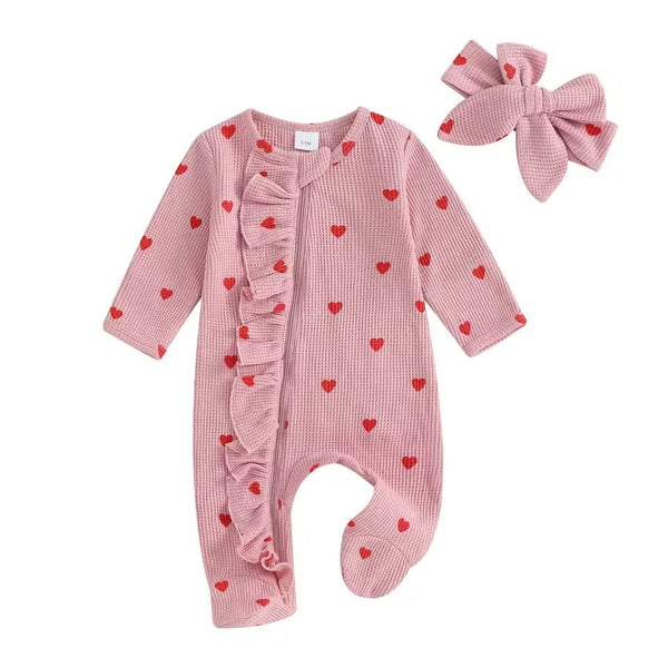 Baby girl long sleeve ruffle onesie with matching headband in pink red hearts – adorable baby outfit available at 1Love 2Hugs 3Kisses Ibiza.