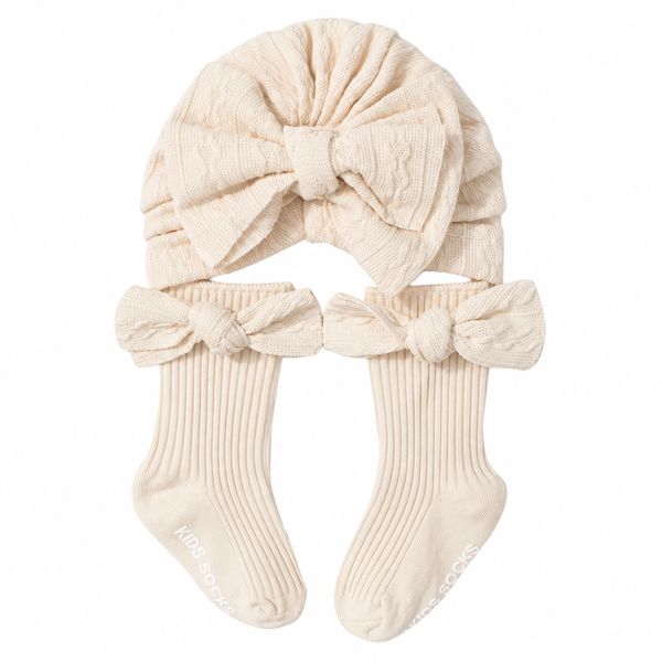 Baby Knitted Hat & Bow Socks Set – Cream Available at 1love2hugs3kisses Ibiza