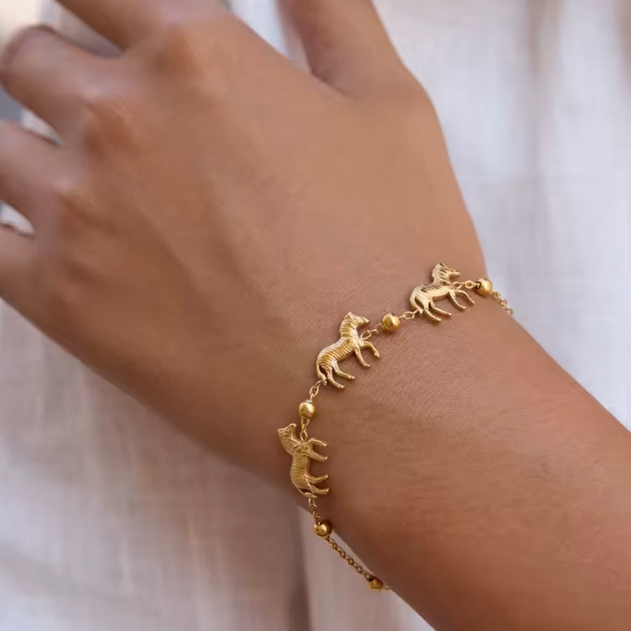 Horse Charm Bracelet – Gold Available at 1love2hugs3kisses Ibiza